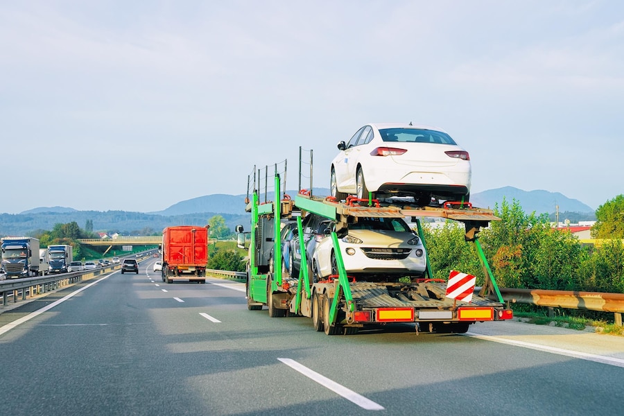 A car loaded on a flatbed truck, ready for car transportation service from yelahanka Bangalore to its next destination.